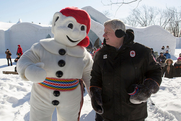 One academic cautions that election polls tend to underestimate support for the incumbent party. Photo of Prime Minister Stephen Harper with Bonhomme by pmwebphotos Flickr.